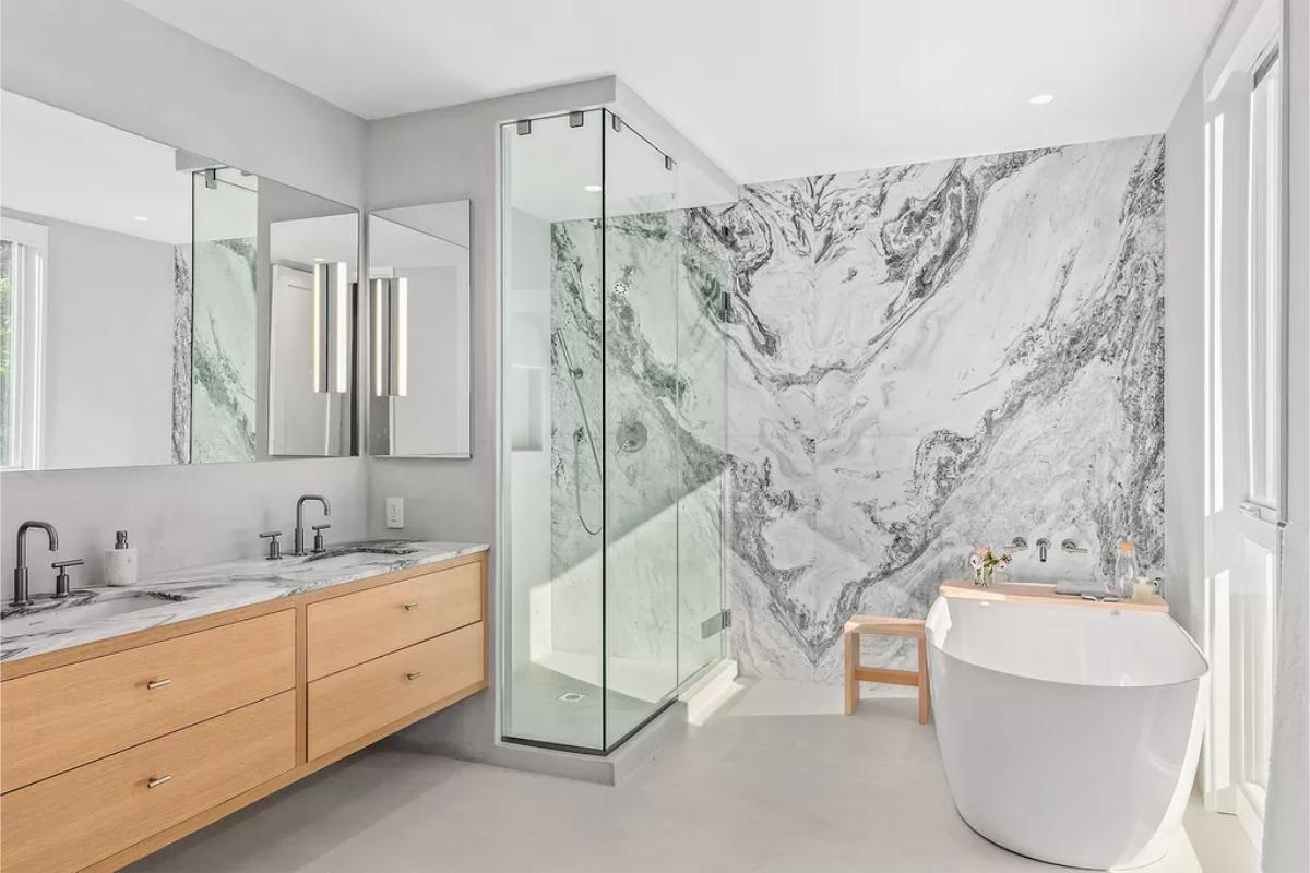 Bathroom with a sink, soaking tub and a walk-in shower.