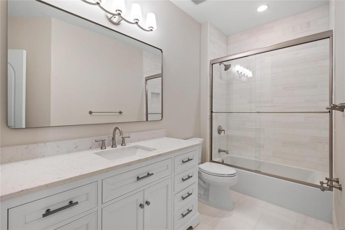 Bathroom with a sink, soaking tub and a walk-in shower.
