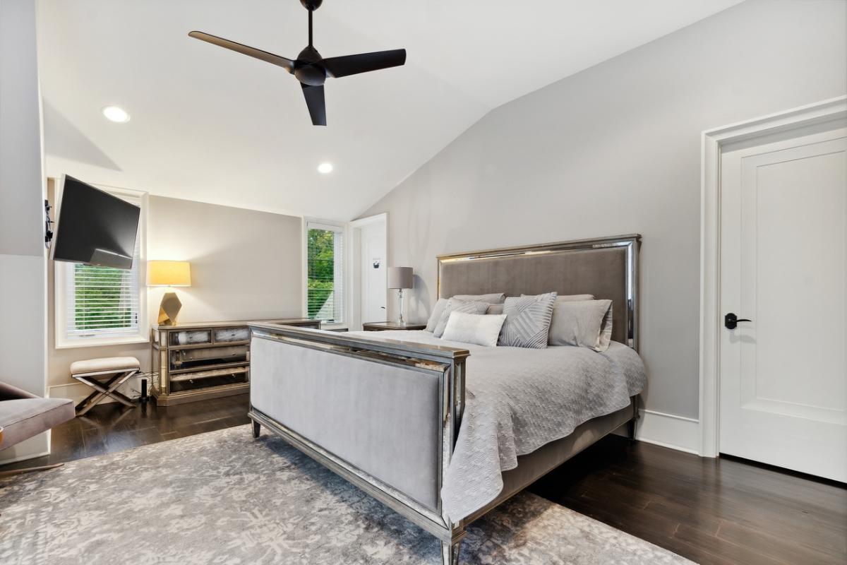 Bedroom with hardwood floor and glass windows.