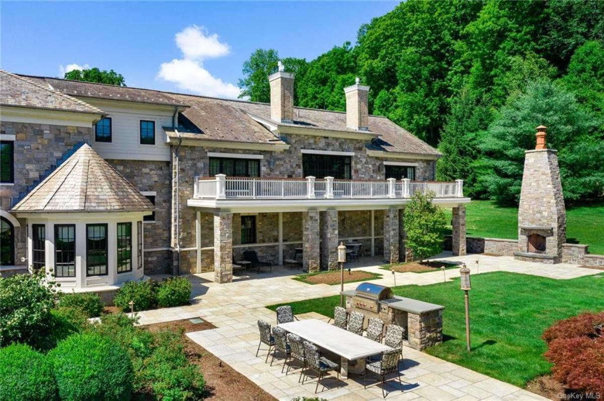 Rear view of the mansion with a grill area.