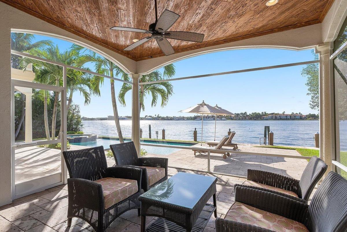 Covered patio overlooking the wide water Intracoastal Waterway.