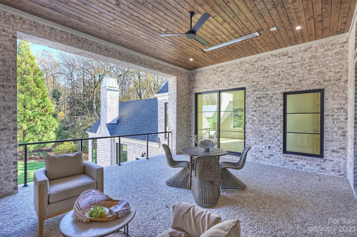 Balcony with tables and chairs.