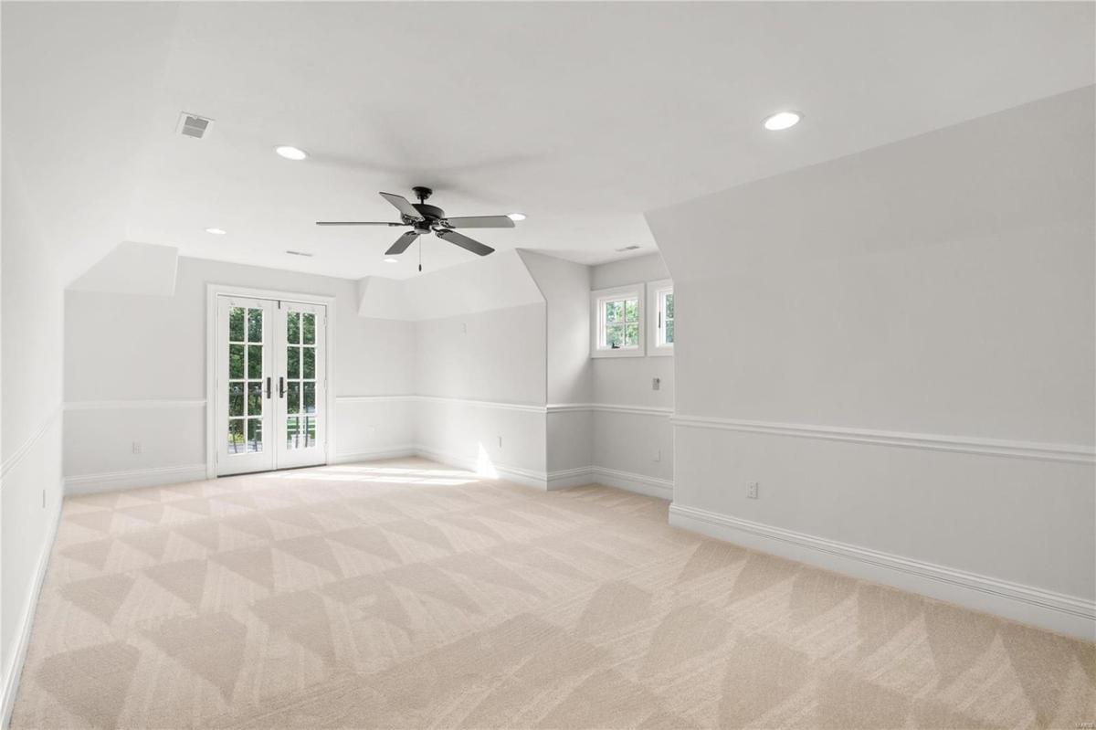 Bedroom with carpet flooring.