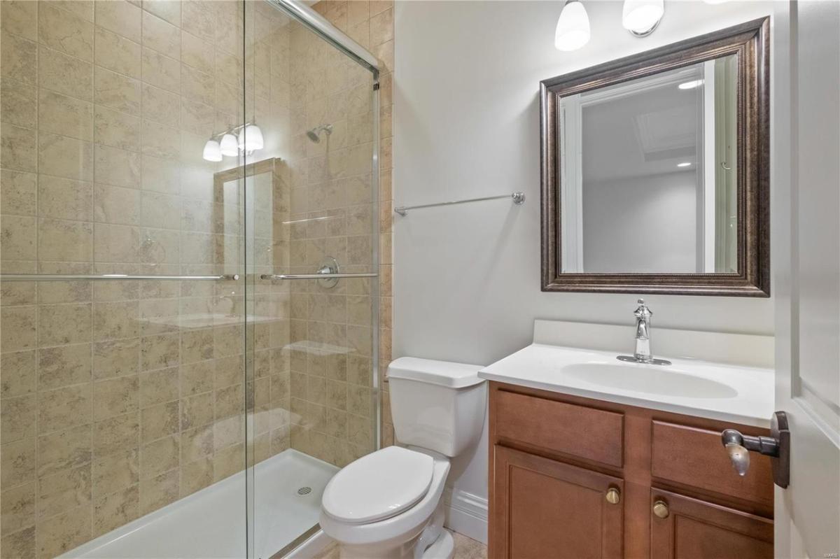 Bathroom with a sink and a walk-in shower.