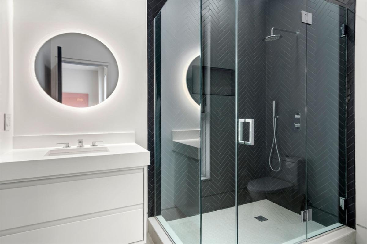 Bathroom with a sink and a walk-in shower.