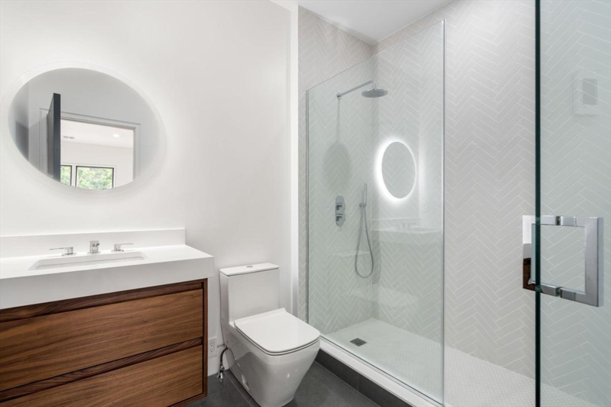 Bathroom with a sink, soaking tub and a walk-in shower.