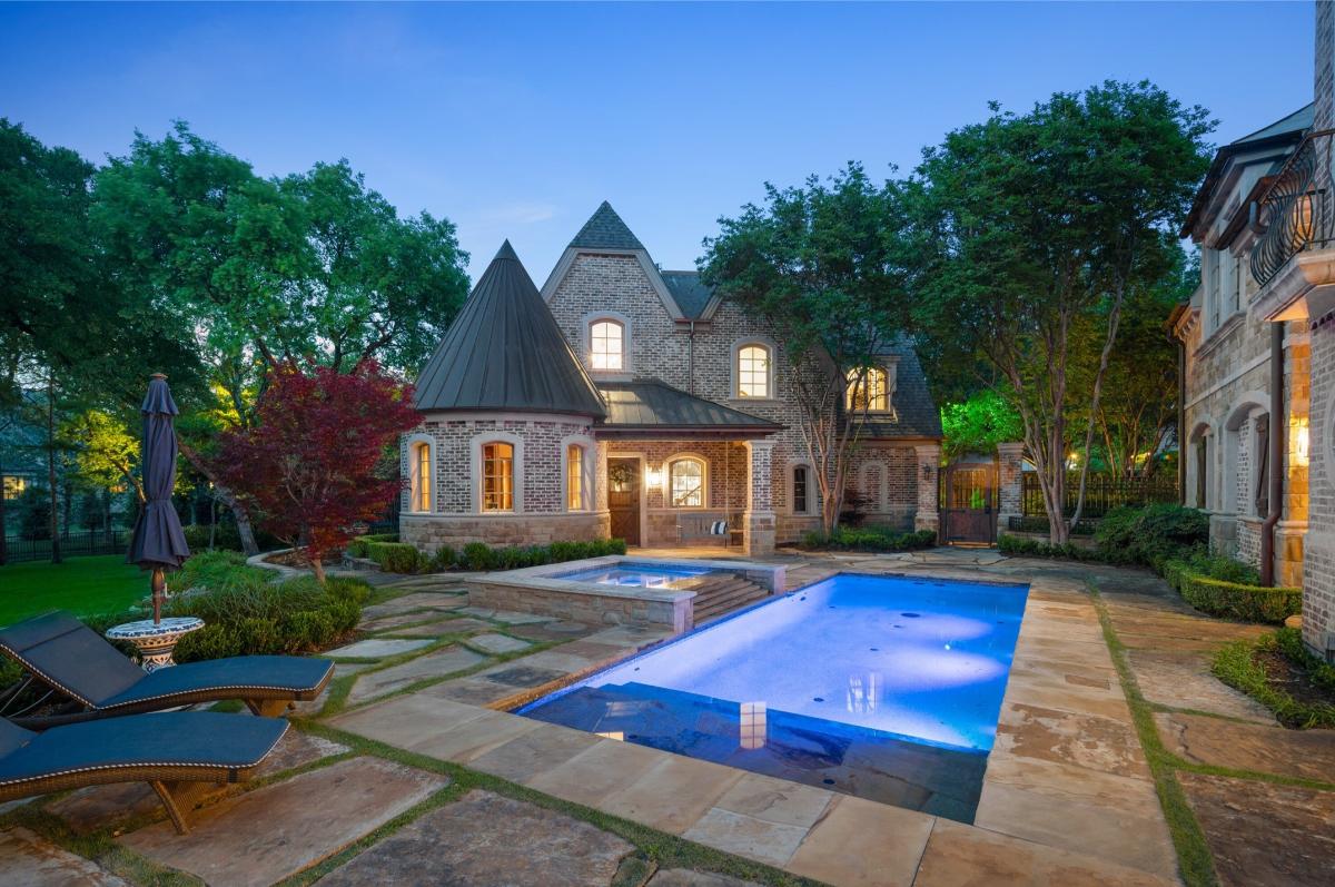 Backyard of the mansion with a pool.