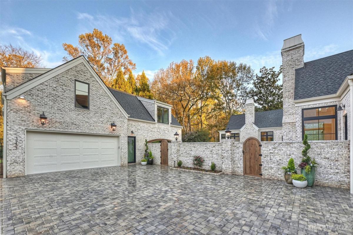 Garage with spacious driveway.