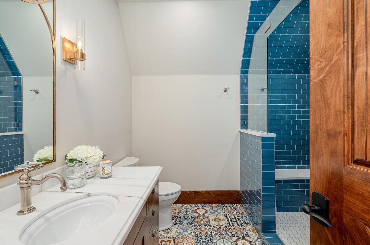 Bathroom with a sink, toilet and a shower.