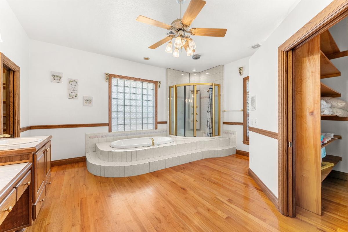 Bathroom with a soaking tub and a walk-in shower.