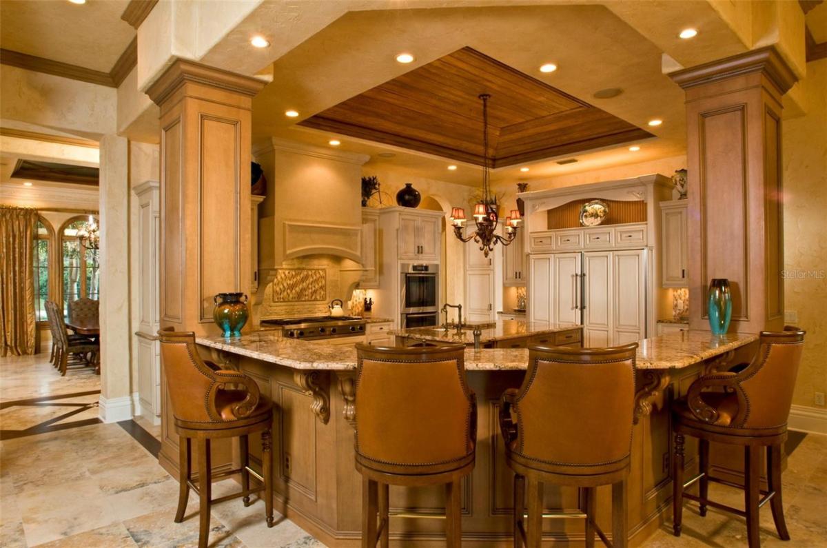 Kitchen with custom lighting and custom cabinetry.