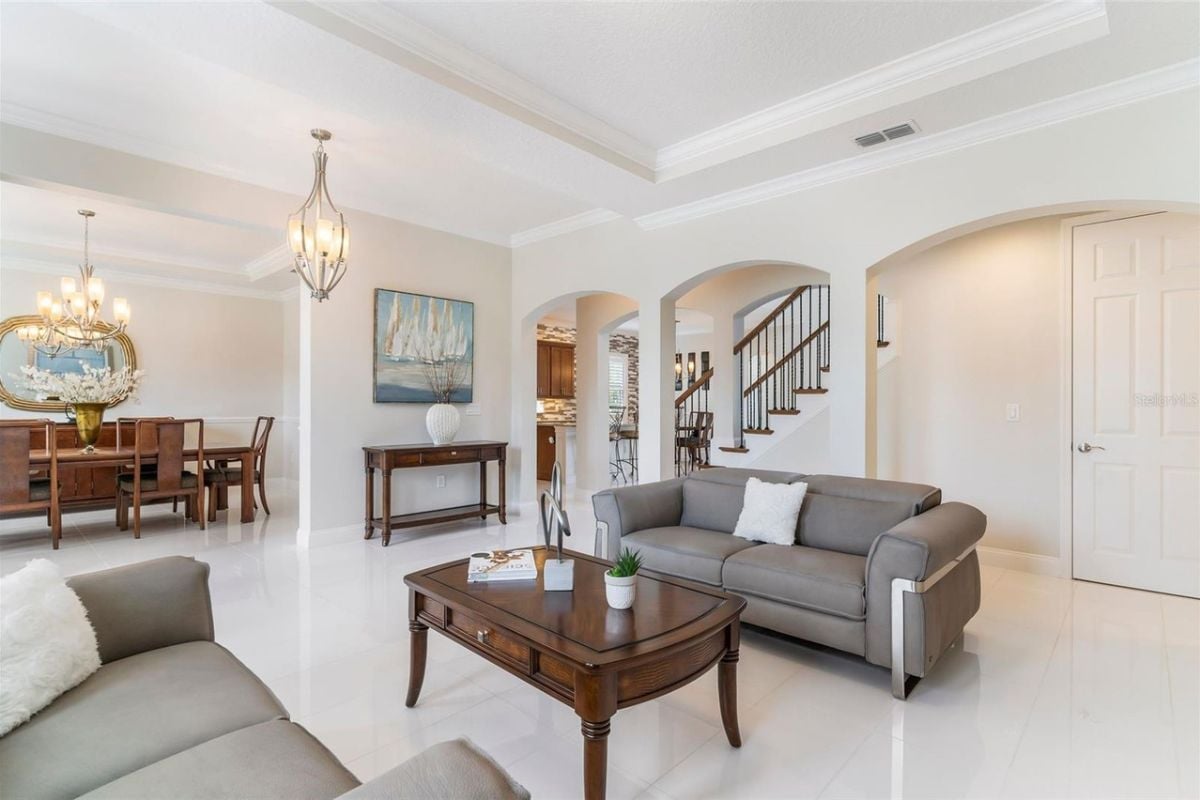 A living room with gray couches and a center table.