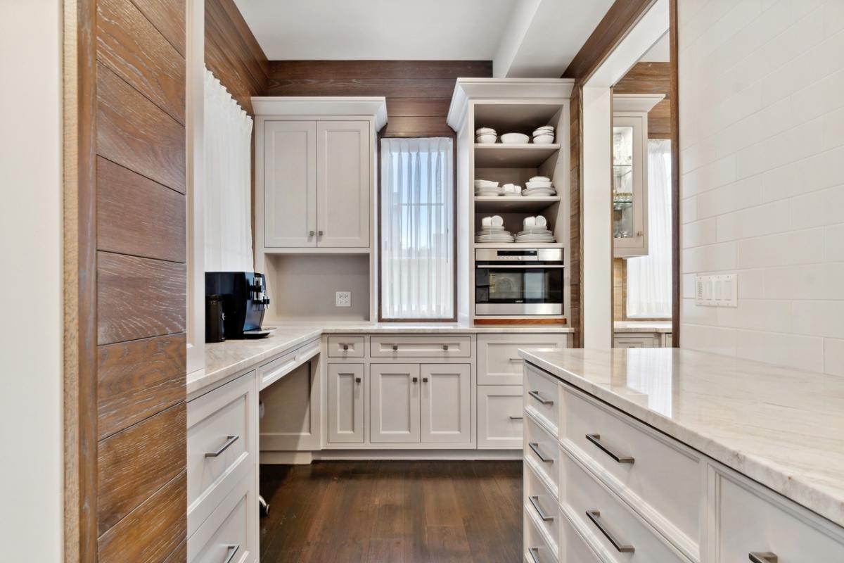Pantry with custom cabinetry.