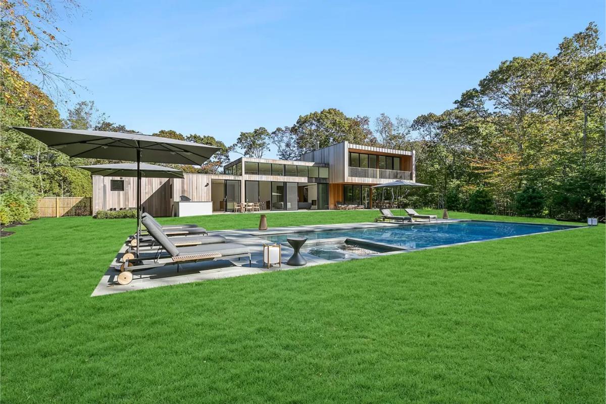 Rear view of the mansion with a pool.