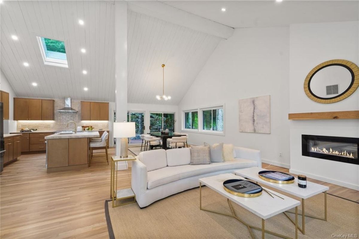 A great room featuring living space, a dining area, and a kitchen.
