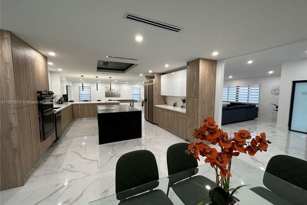 A great room combining living space, dining area, and kitchen.