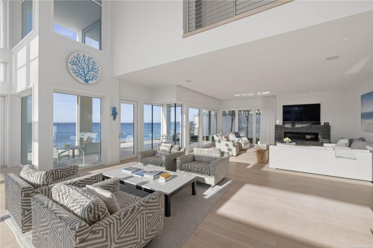 Living room with couches. sofas and a fireplace.