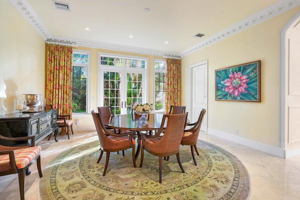 Breakfast nook with a wood table and chairs.