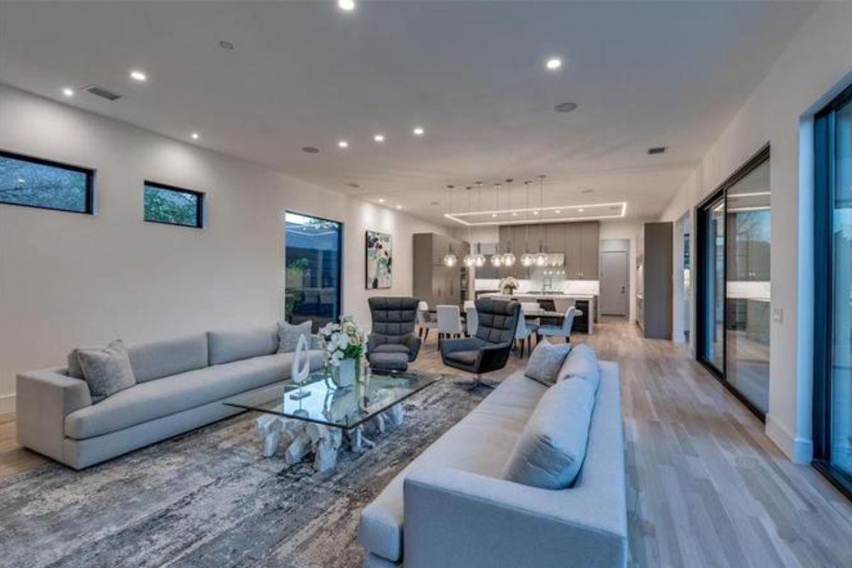 A great room with living space, dining area, and kitchen.