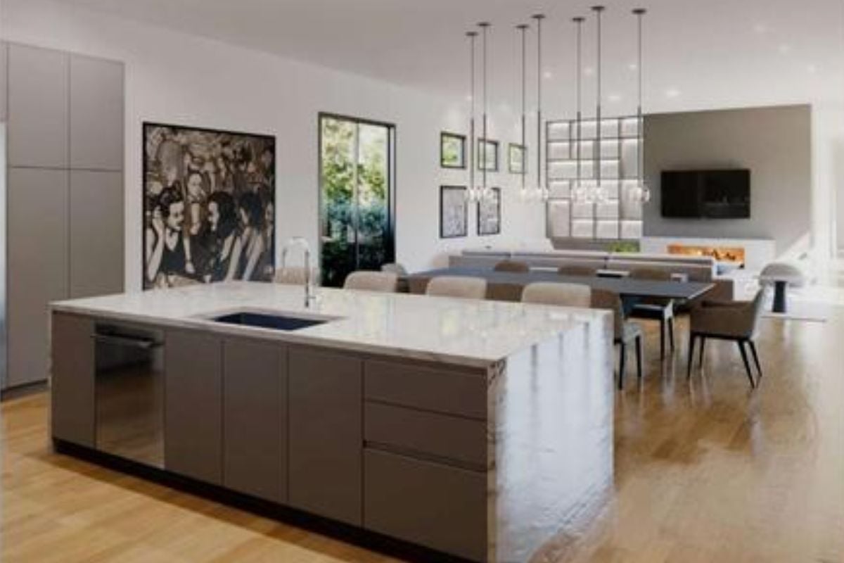 A great room with living space, dining area, and kitchen.