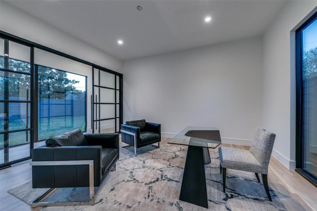 A home office with chairs and a desk.