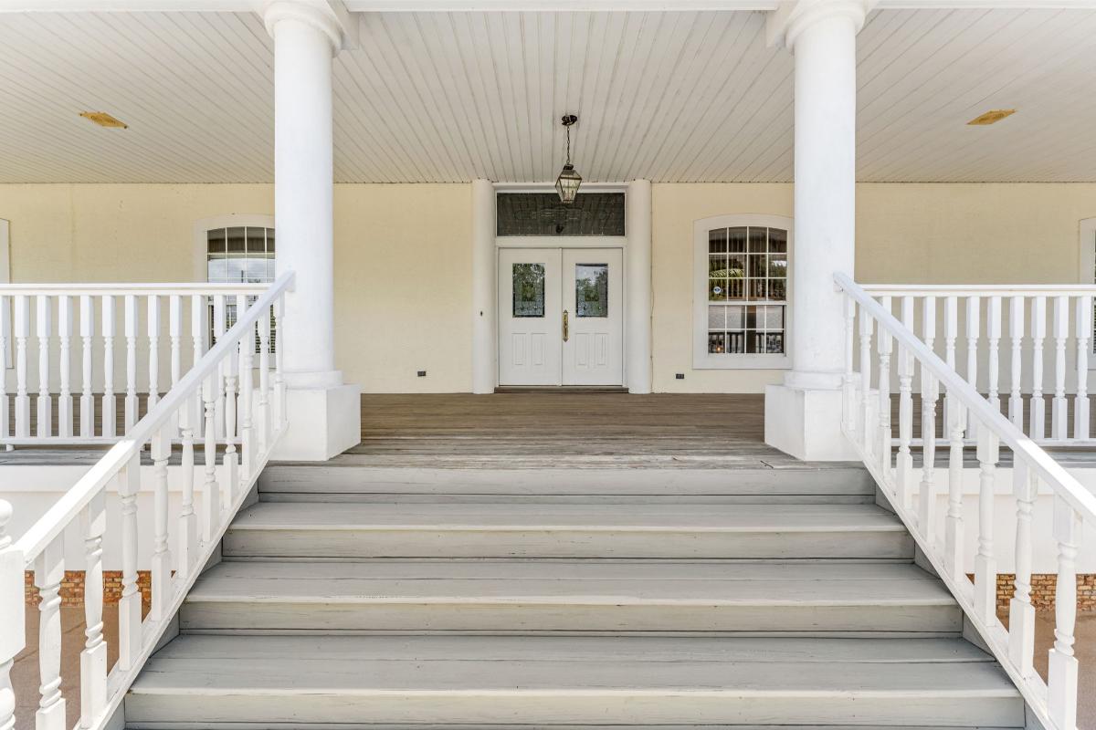 Front entry of the house with a porch.