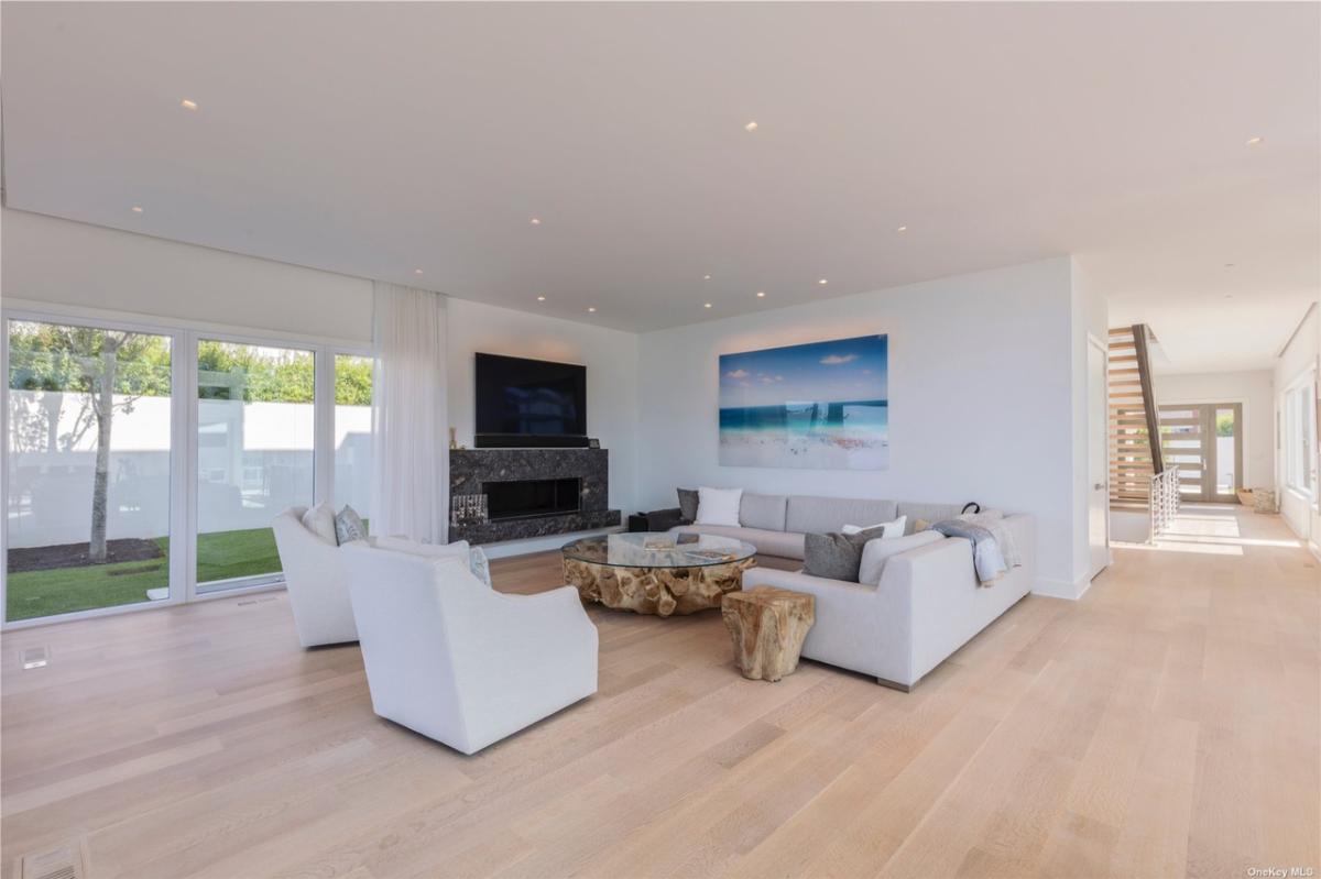 Living room with couches. sofas and a fireplace.