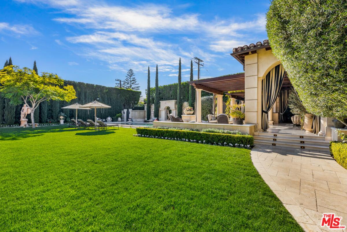 Backyard of the mansion with a pool.