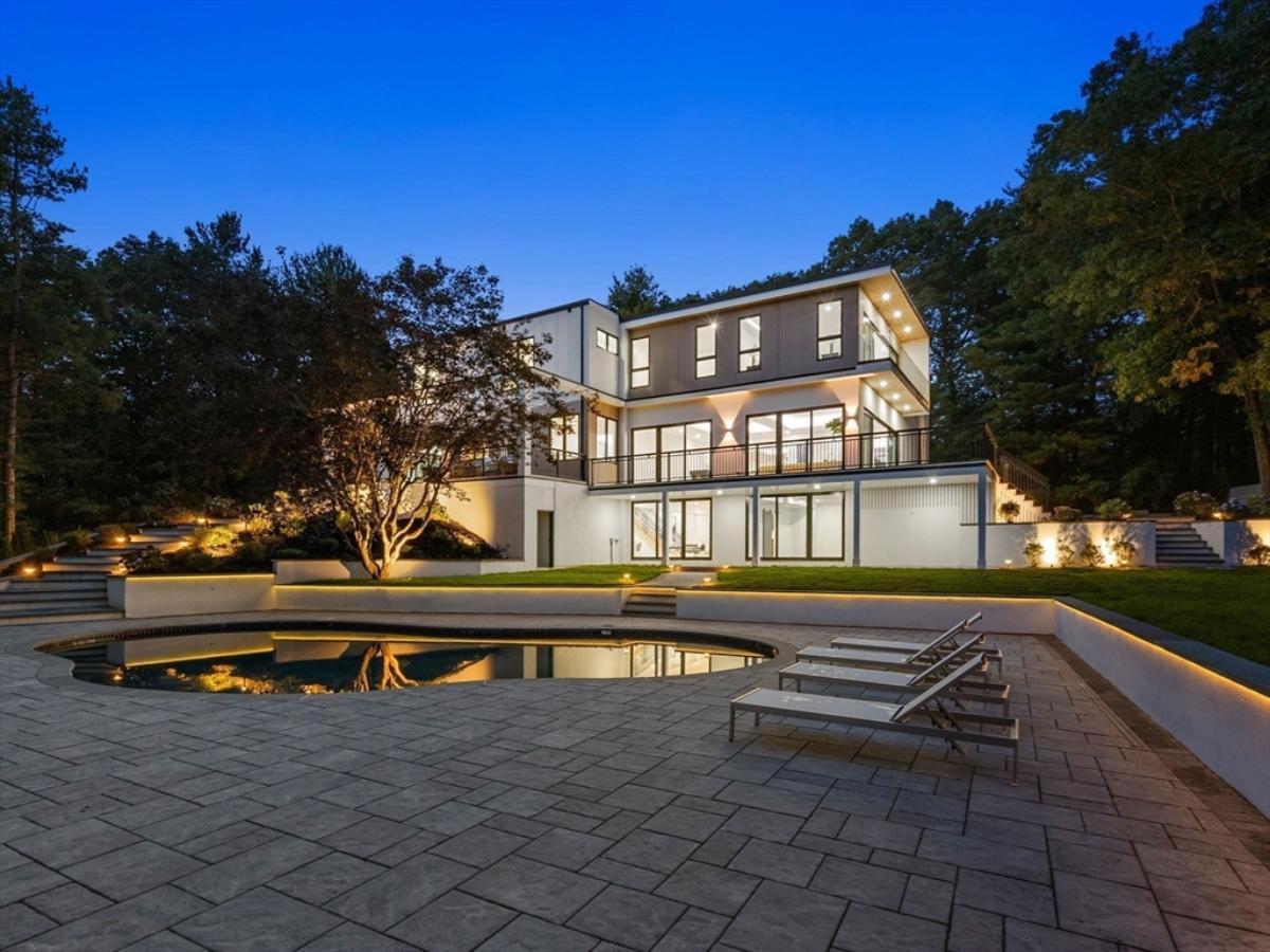Rear view of the mansion with a pool.