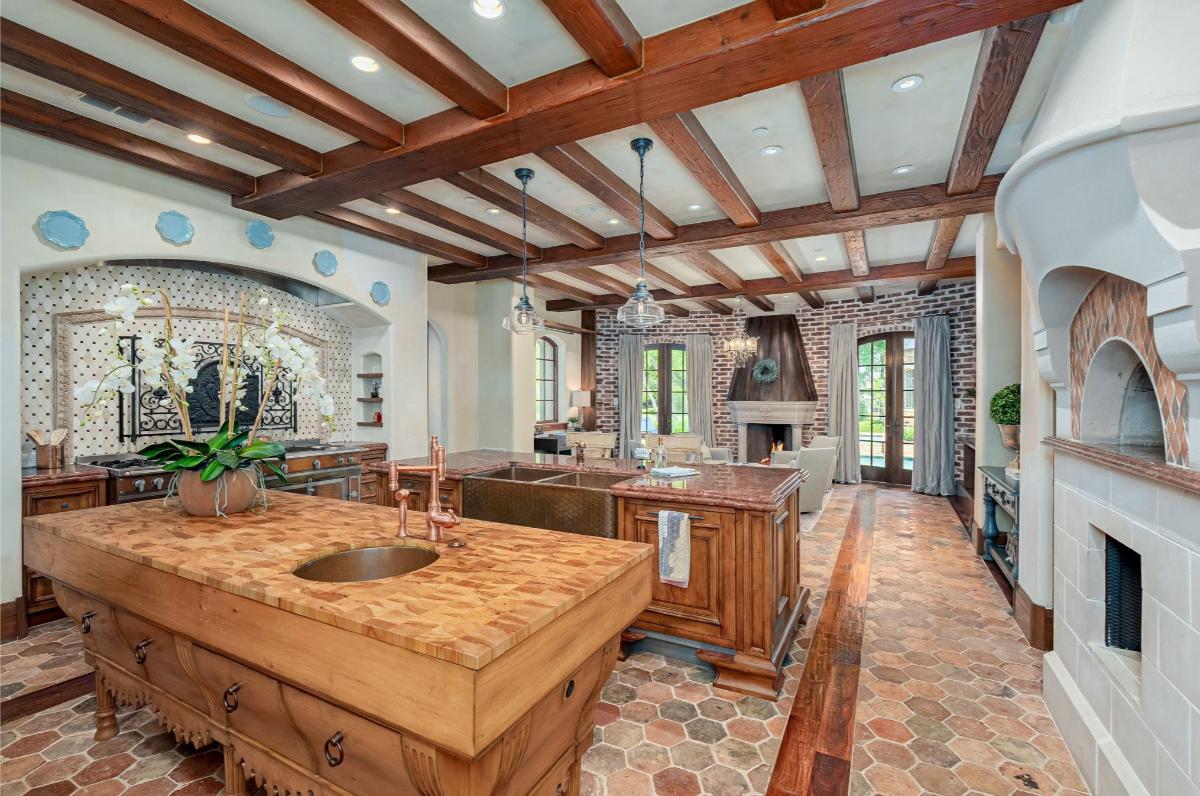 Kitchen with large islands and vaulted ceilings.