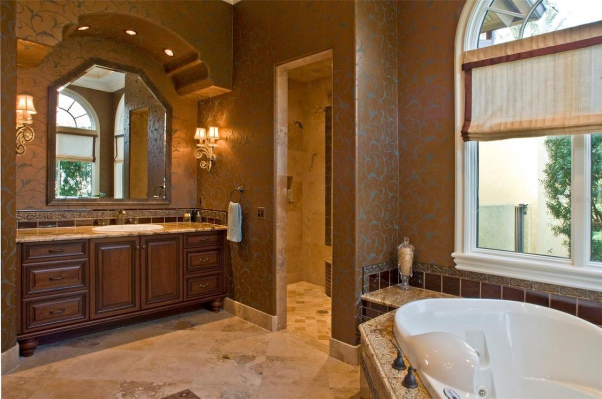 Bathroom with a custom-made vanity and a soaking tub.