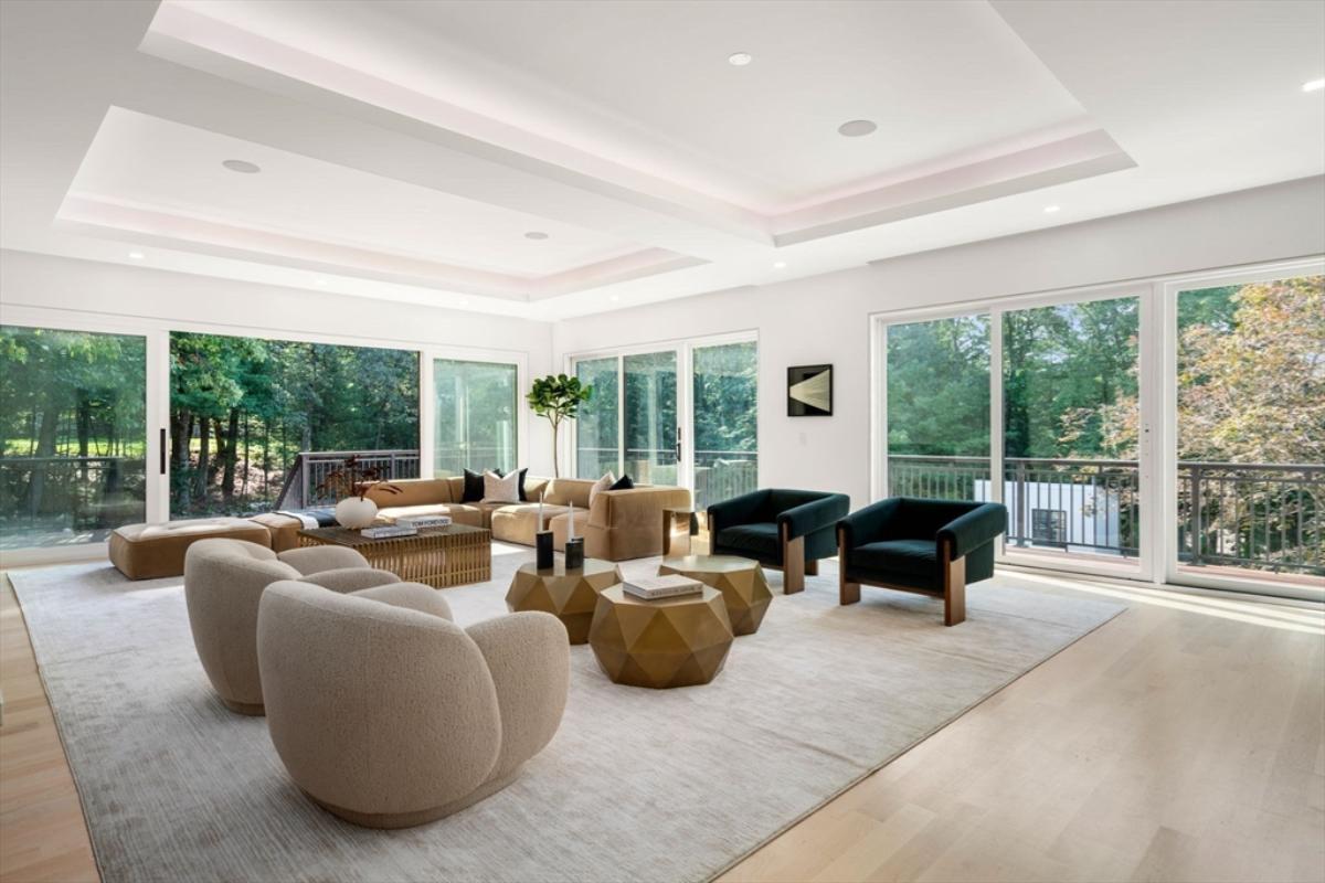 Living room with hardwood floor and sliding glass doors.