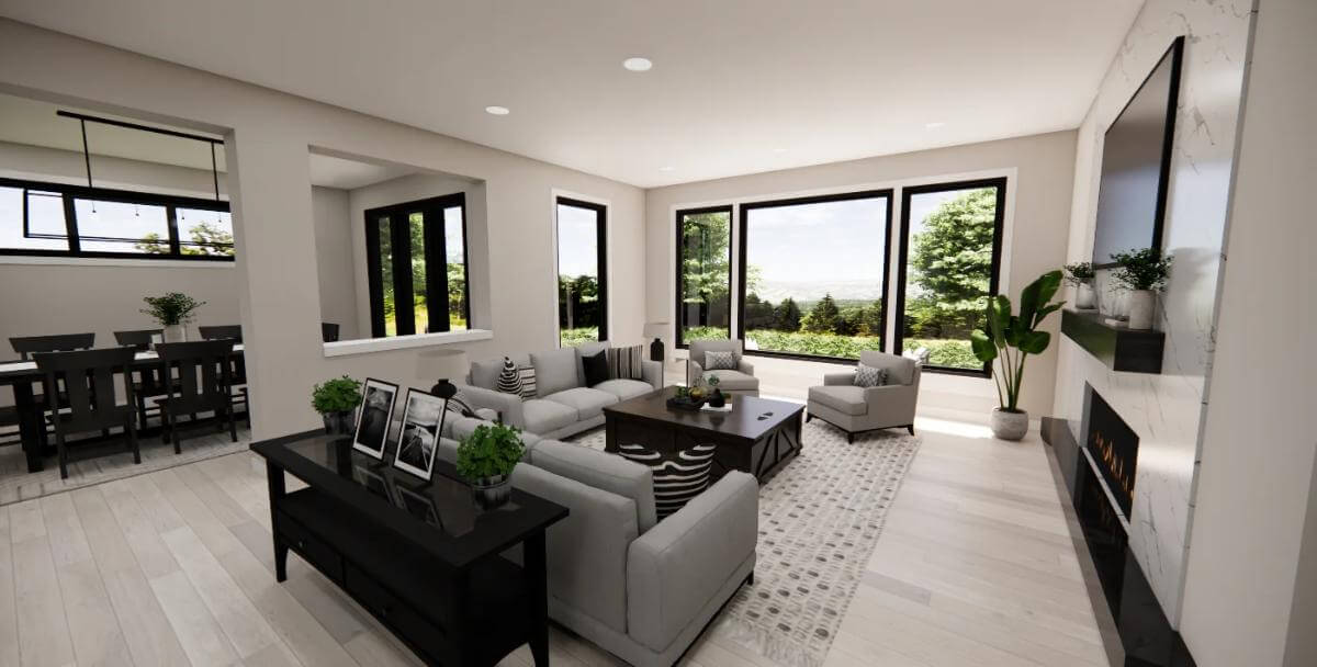 Great room with gray sofas, black tables, and a wall-mounted TV.