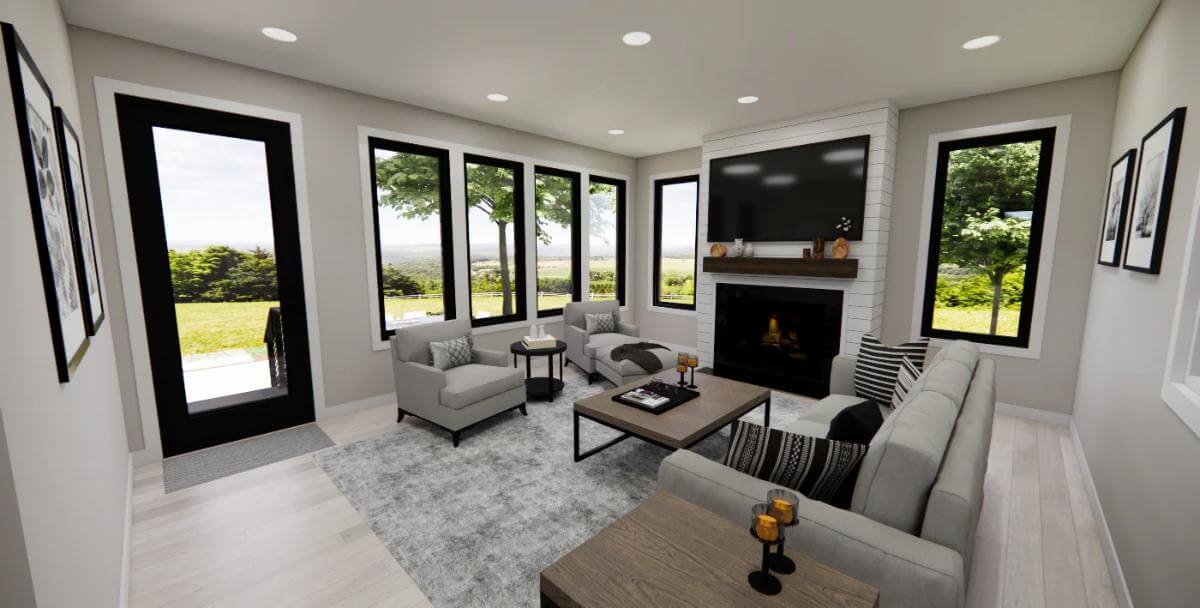 Sunroom with gray seats and a fireplace topped with a TV.