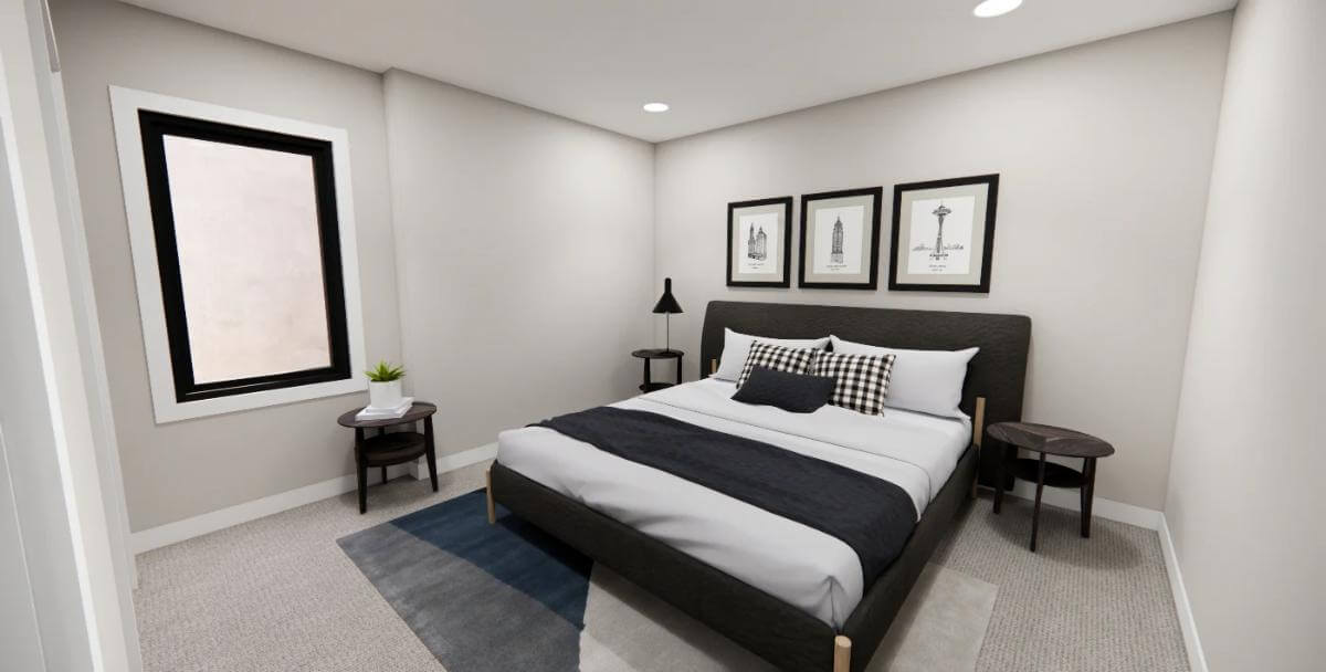 Bedroom with an upholstered bed and round tables over the carpeted floor.