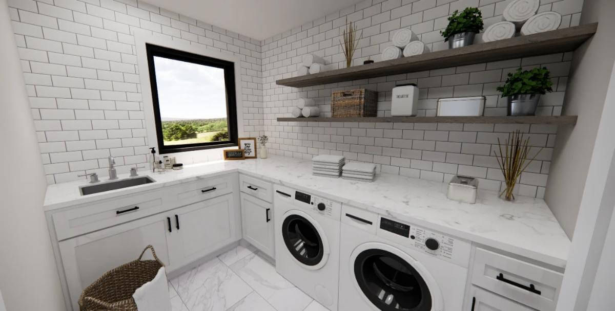 Laundry room with marble counters, white cabinets, and floating shelves fixed against the subway tiled backsplash.