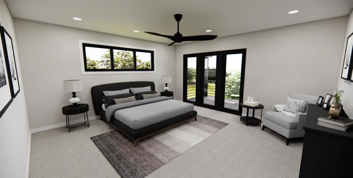 Primary bedroom with an upholstered bed, a cushioned chair, and private access to a covered deck.