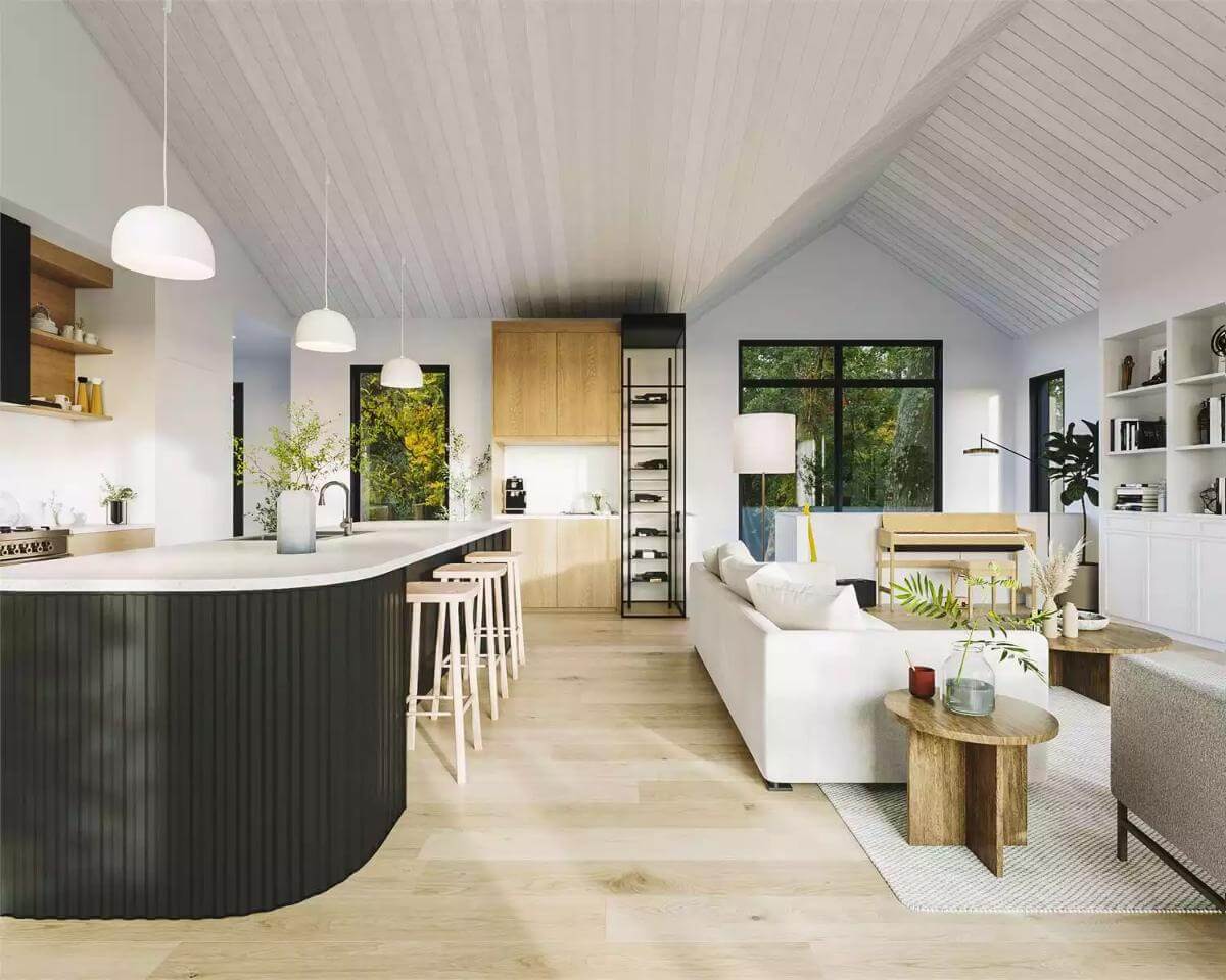 Kitchen and living room with light hardwood floor and a vaulted ceiling.