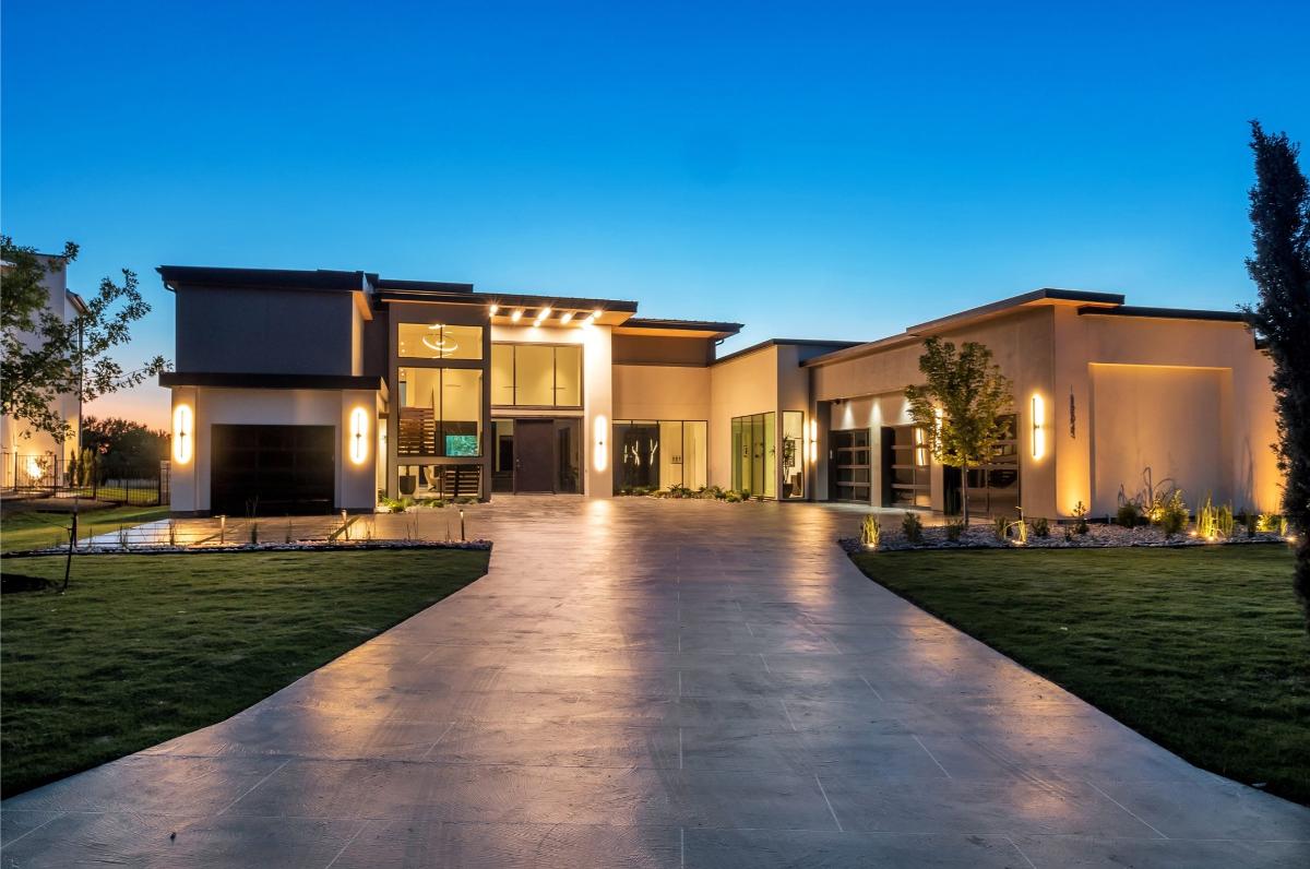 Front view of the mansion with huge lawn.