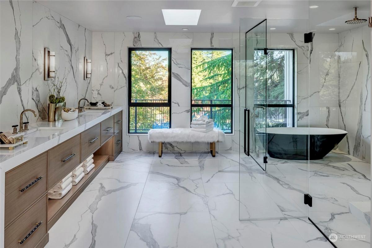 Bathroom with a custom-made vanity, a soaking tub and a walk-in shower.