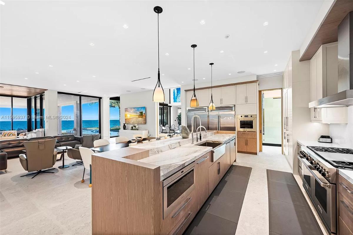 Kitchen with stainless-steel appliances and a center island prep area.