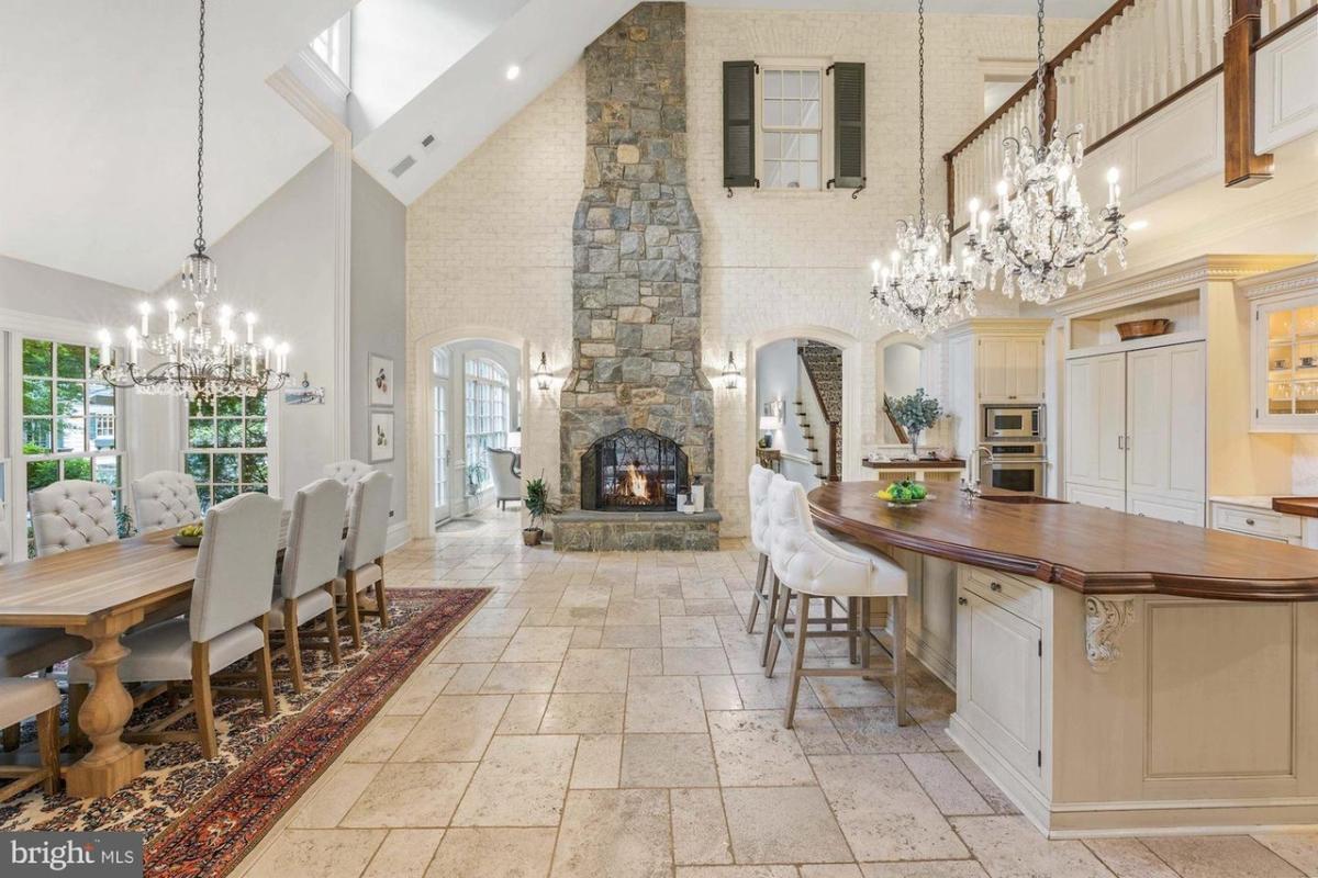 Kitchen with chandelier, a fireplace and a breakfast nook.