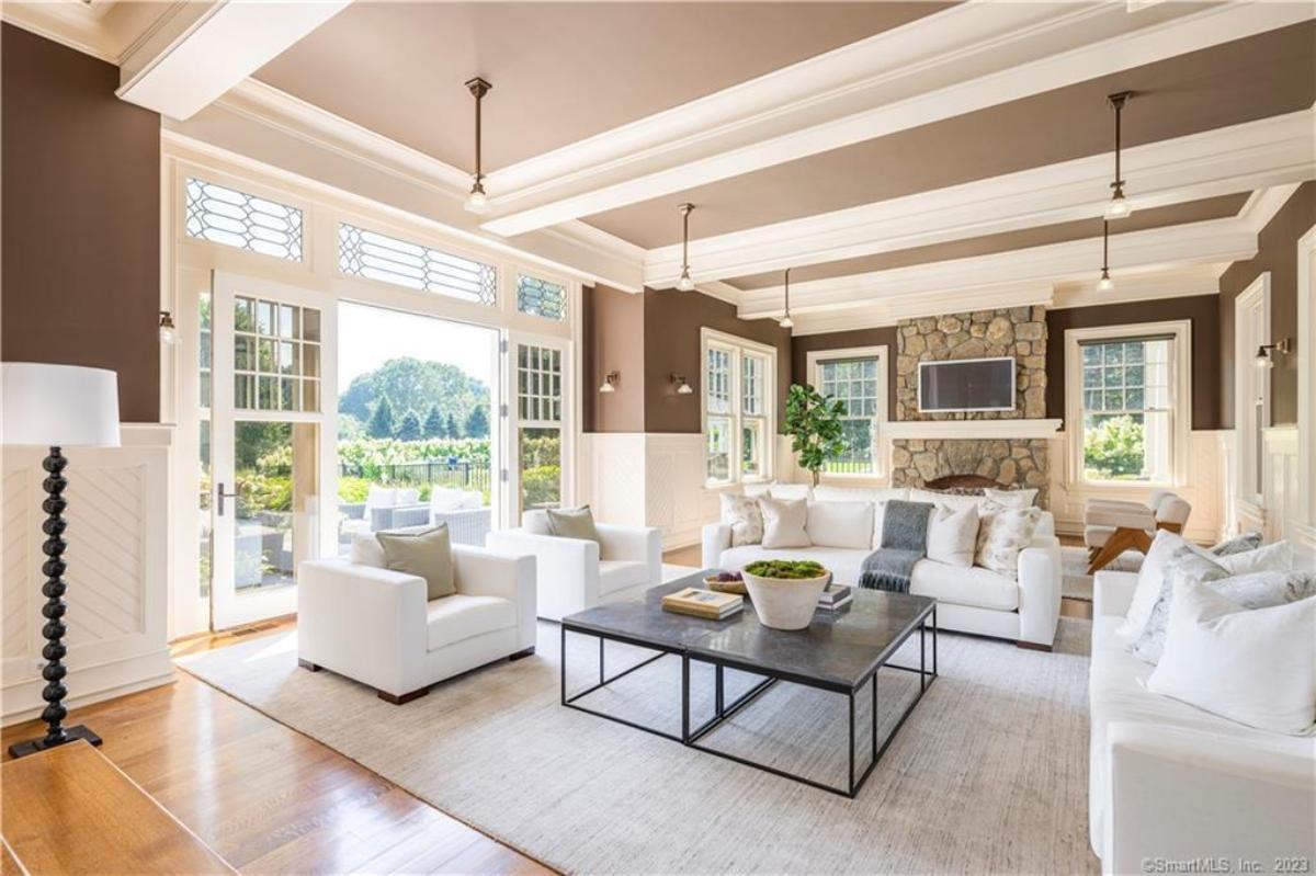 Living room with couches and a fireplace.