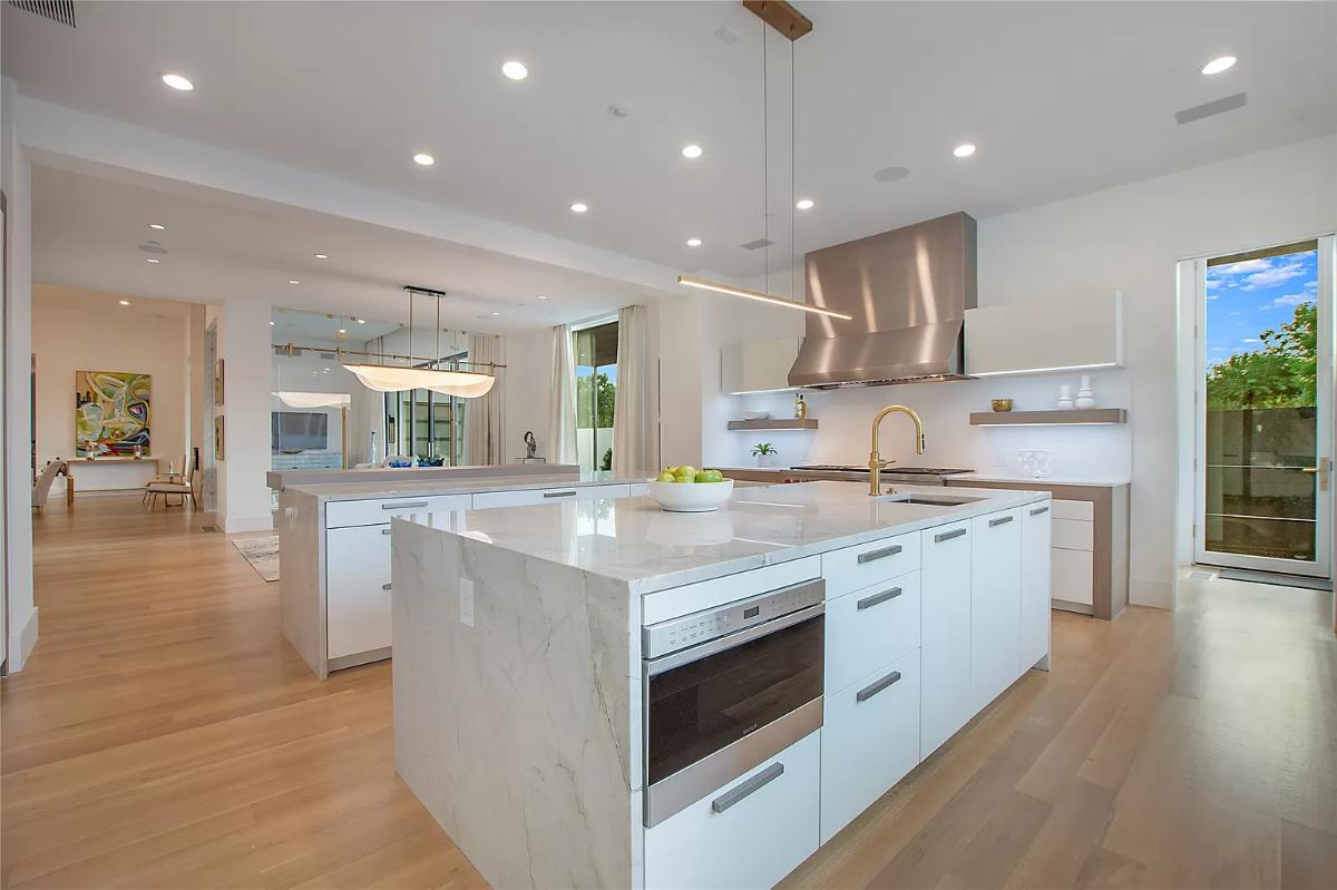 Kitchen with counter breakfast bar and a center island prep area.