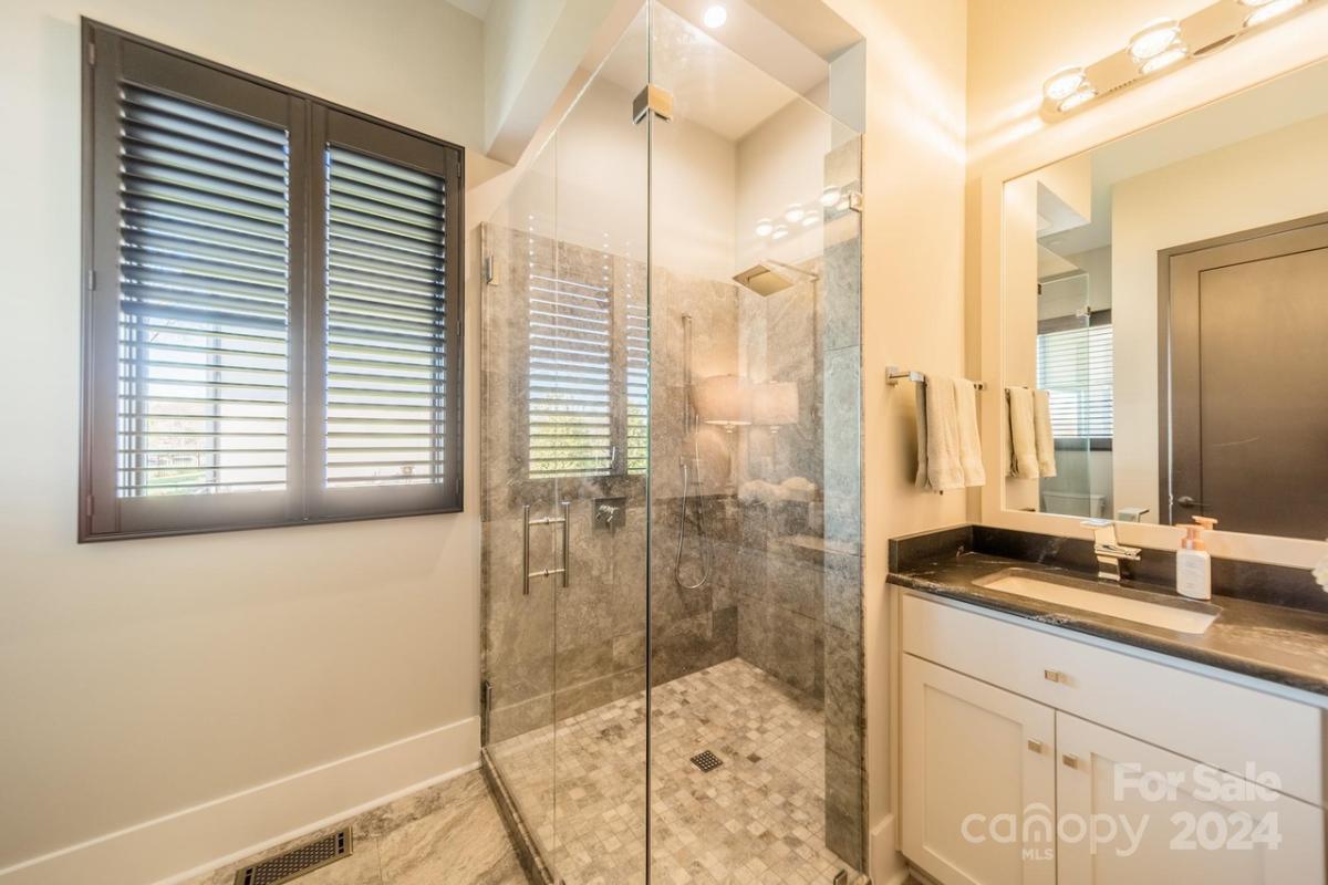 Bathroom with a sink and a walk-in shower