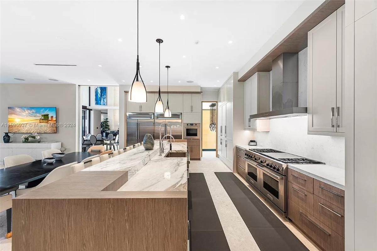 Kitchen with stainless-steel appliances and a center island prep area.