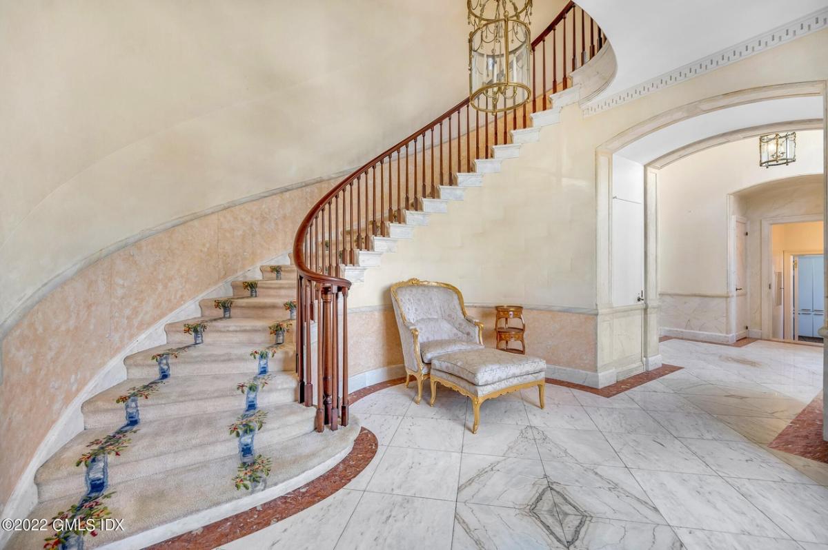 Stairs with a chandelier.