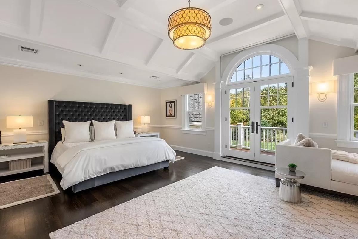 Bedroom with hardwood floors and glass doors.