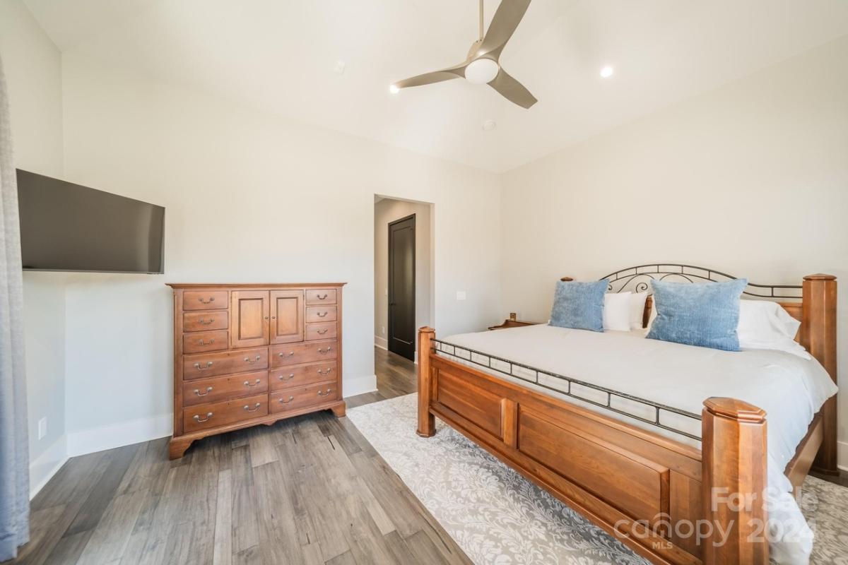 Bedroom with a TV and a dresser.