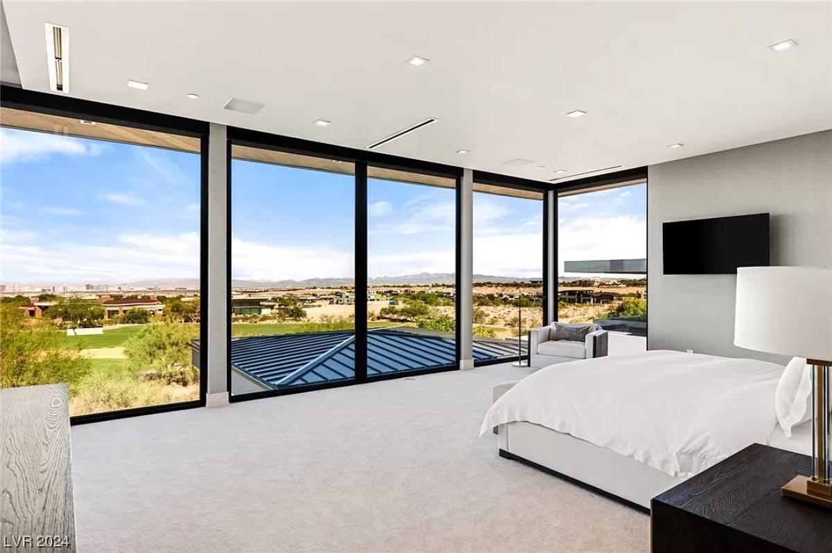 Bedroom with a view of the city.
